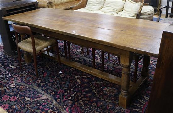 A 17th century style oak refectory table W.240cm